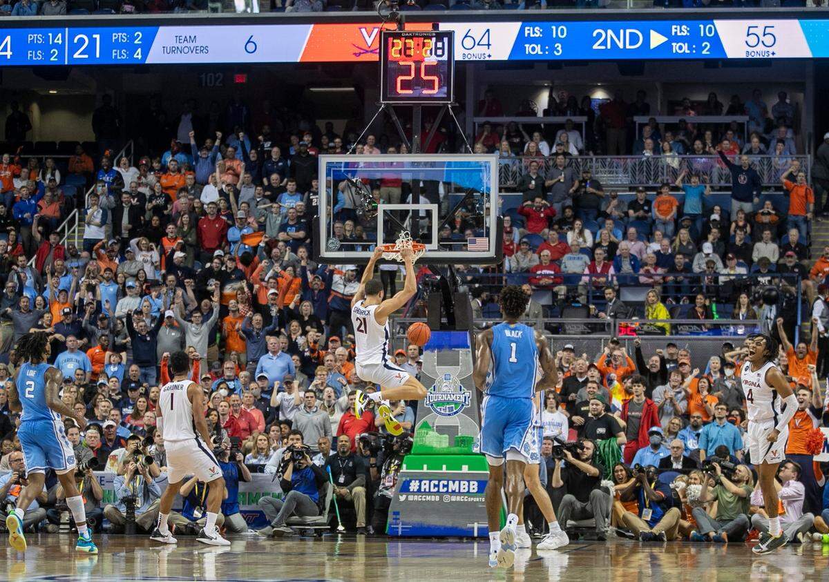 Virginia’s Kadin Shedrick (21) ices the Tar Heels with a dunk in the closing seconds of play in their 68-59 victory during the third round of the ACC Tournament on Thursday, March 9, 2023 at the Greensboro Coliseum in Greensboro, N.C.