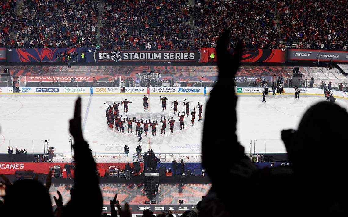 Fans cheer along with the Hurricanes as they do the storm surge after Carolina’s 4-1 victory over Washington in the NHL Stadium Series game between the Hurricanes and the Capitals at Carter-Finley Stadium in Raleigh, N.C., Saturday, Feb. 18, 2023.