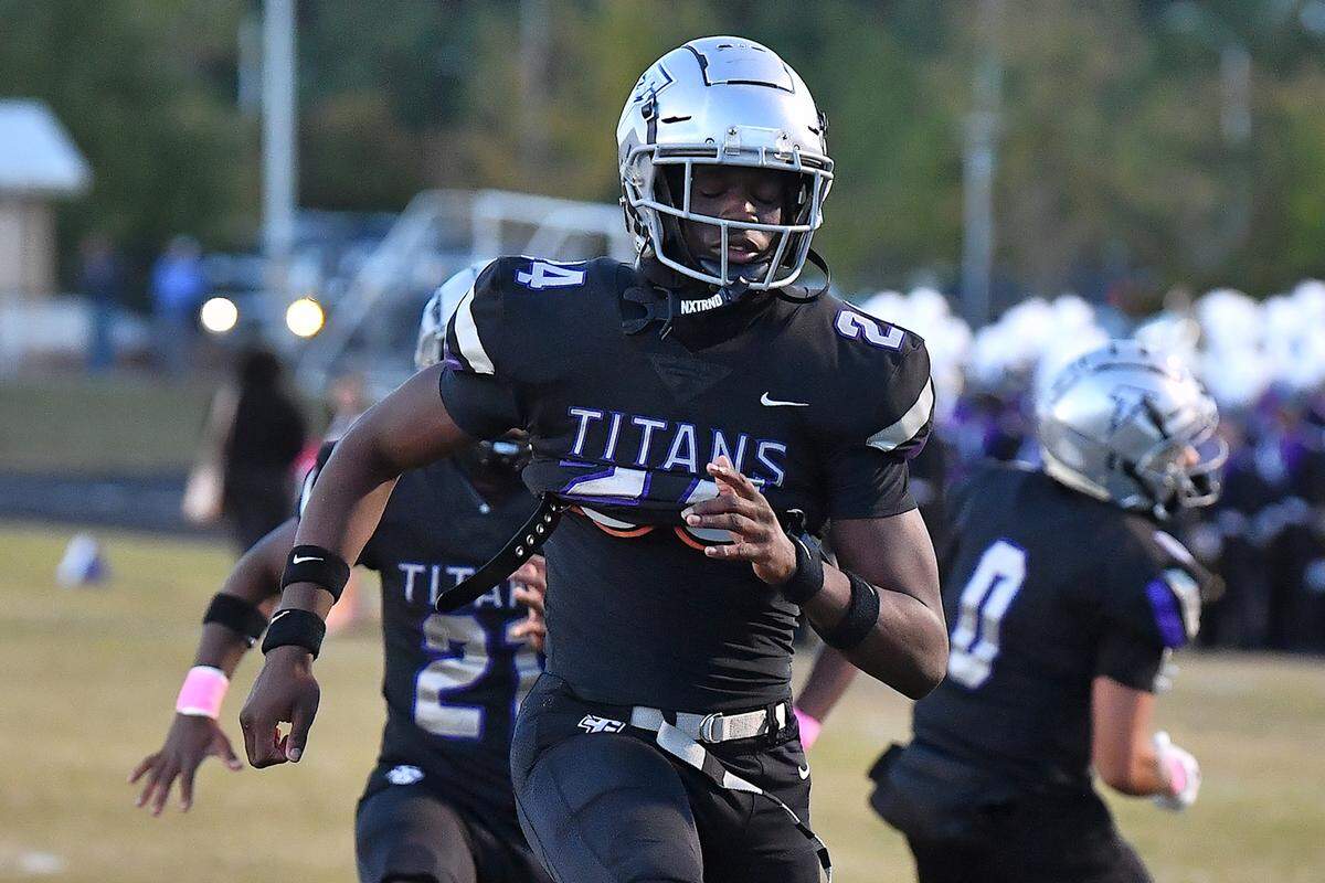 South Garner defensive end Ebenezer Ewetade (24) takes part in pre-game drills before his team's contest against Garner. The South Garner Titans and the Garner Trojans met in a conference football game in Raleigh, N.C. October 17, 2025