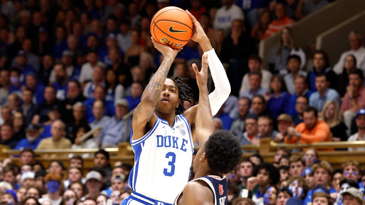 Duke’s Isaiah Evans (3) hits a three-pointer as Auburn’s JP Pegues (1) defends during the first half of Duke’s game against Auburn at Cameron Indoor Stadium in Durham, N.C., Wednesday, Dec. 4, 2024.