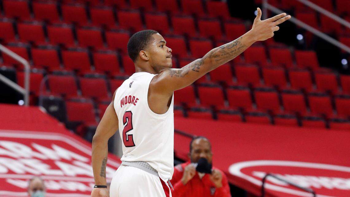 N.C. State’s Shakeel Moore (2) celebrates making a three-pointer during the first half of N.C. State’s game against UNC at PNC Arena in Raleigh, N.C., Tuesday, December 22, 2020.