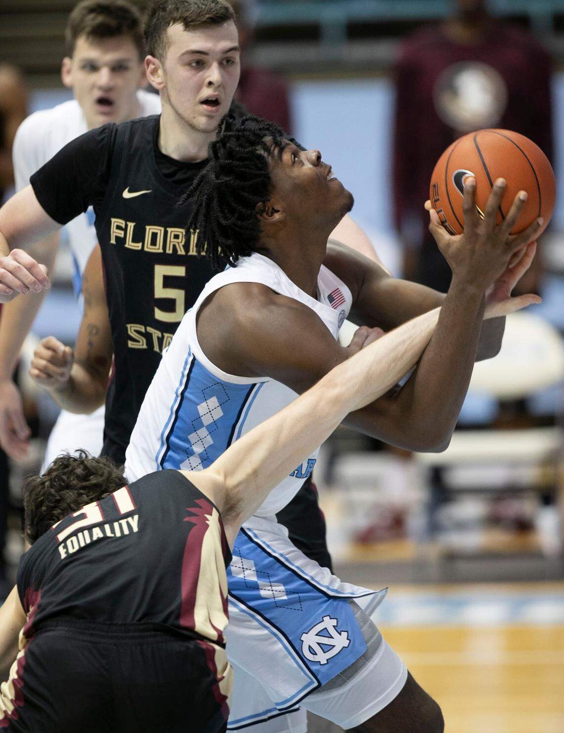 Florida State’s Wyatt Wilkes (31) fouls North Carolina’s Day’Ron Sharpe (11) during the first half on Saturday, February 27, 2021 in Chapel Hill, N.C.