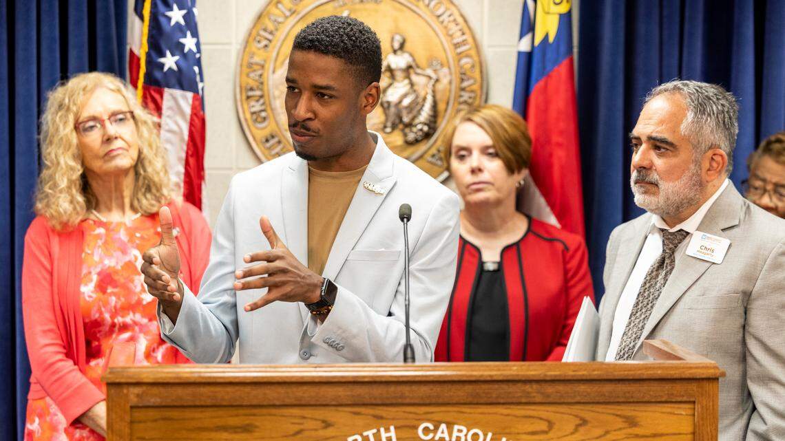Wake County Board of Education members Tyler Swanson, left, and vice-chair Chris Heagarty speak during a press conference at the State Legislative Building on Monday, Aug 14, 2023. House Democrats, joined by school board members and parents, held news conferences across the state Monday to raise concerns about the lack of a state budget and GOP budget plans.
