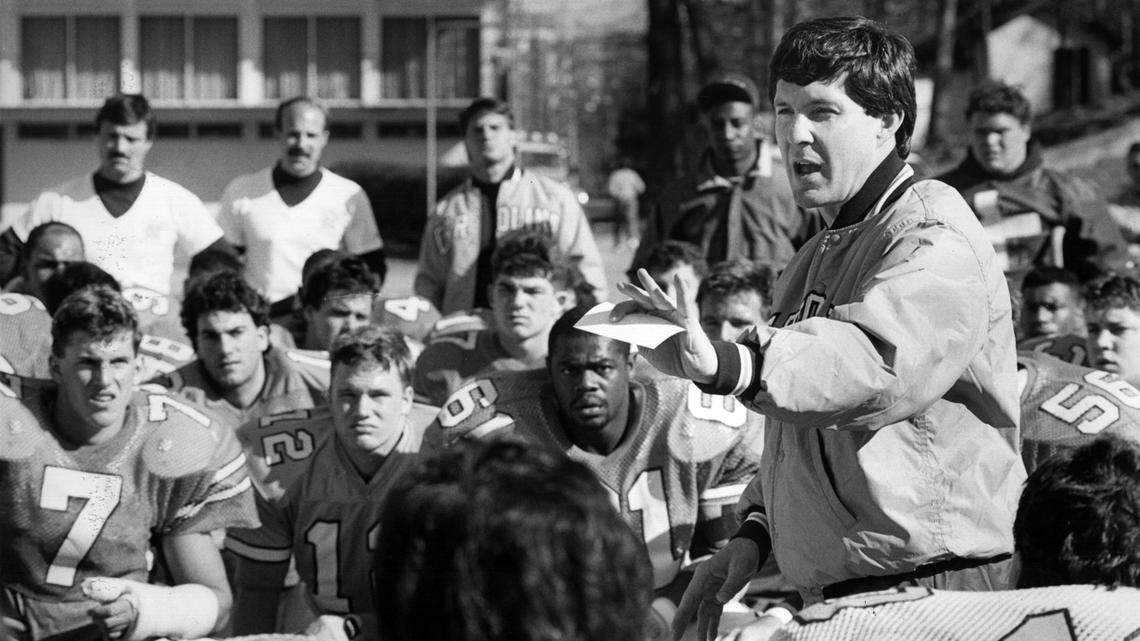 UNC football coach Mack Brown speaks to players during a 1988 practice. 