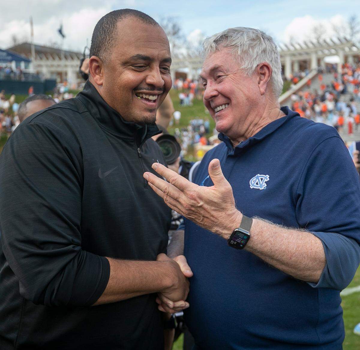Virginia coach Tony Elliott congratulates North Carolina coach Mack Brown following the Tar Heels’ 31-28 victory on Saturday, November 5, 2022 at Scott Stadium in Charlottesville, Va.