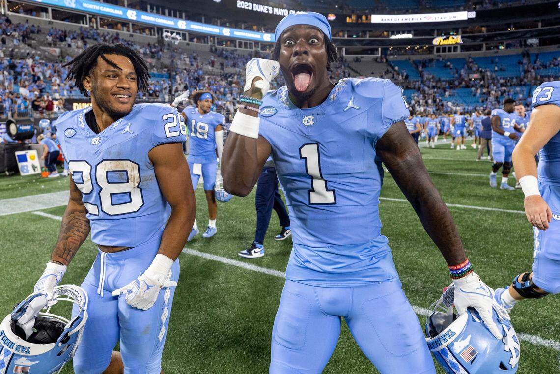 North Carolina’s Andre Green Jr. (1) and Omarion Hampton (28) celebrate the Tar Heels’ Tar Heels’ 31-17 victory over South Carolina on Saturday September 2, 2023 at Bank of America Stadium in Charlotte, N.C.