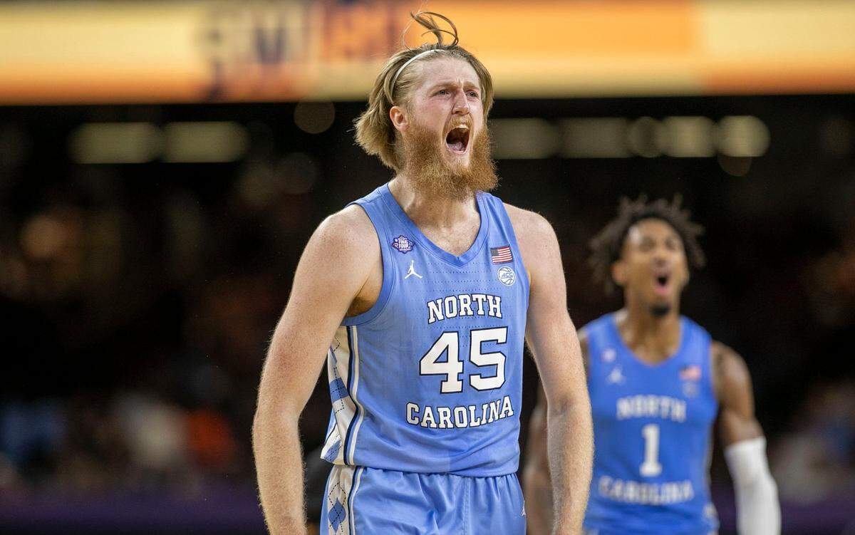 North Carolinas Brady Manek (45) and Leaky Black (1) react after a three-point basket by Manek to give the Tar Heels a 28-22 lead over Kansas during the first half of the NCAA Championship game on Monday, April 4, 2022 at Caesars Superdome in New Orleans, La.