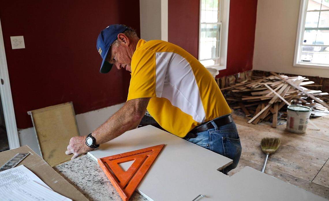 Chip McGuirt of the NC Baptist Men cuts drywall to repair a home damaged by flooding from Hurricane Florence Thursday, Nov. 1, 2018 in Lumberton.