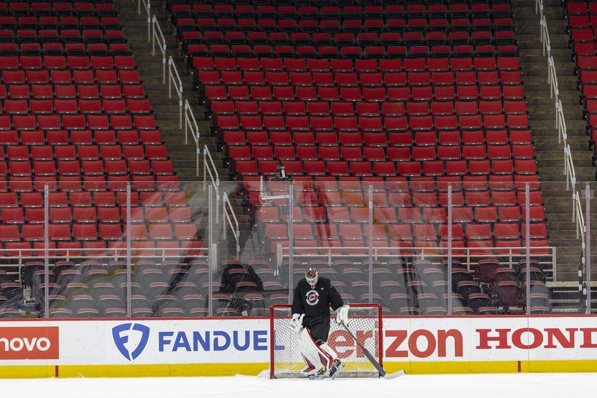 Carolina Hurricanes goalie Brandon Bussi (32), is surrounded by empty seats during the team’s practice on Friday, May 15, 2026 at Lenovo Center in Raleigh, N.C.