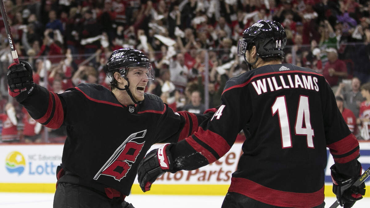 Carolina Hurricanes’ Brock McGinn (23) celebrates with Justin Williams (14), after Williams scored in the third period during Game 6 of their first round Stanley Cup series on Monday, April 22, 2019 at PNC Arena in Raleigh, N.C. The Hurricanes scored three goals in the third period rolling to a 5-2 victory.