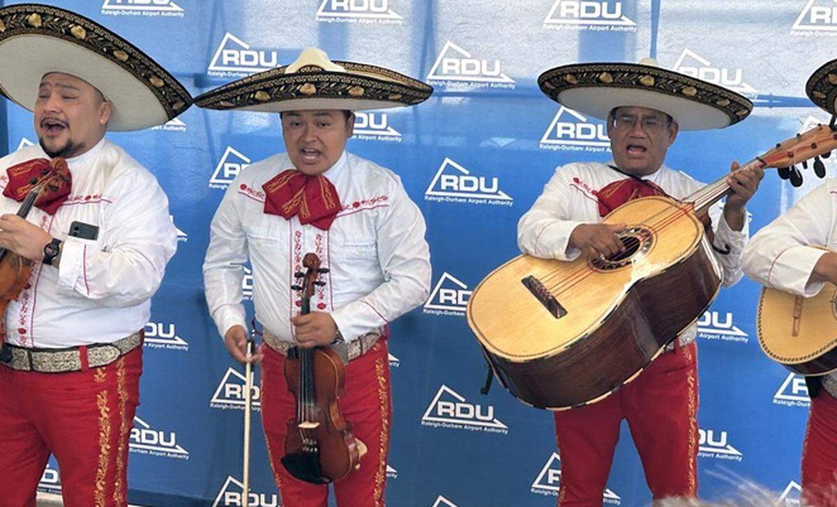 A mariachi band performs at Raleigh-Durham International Airport on Monday to celebrate the first nonstop flight from Mexico City.