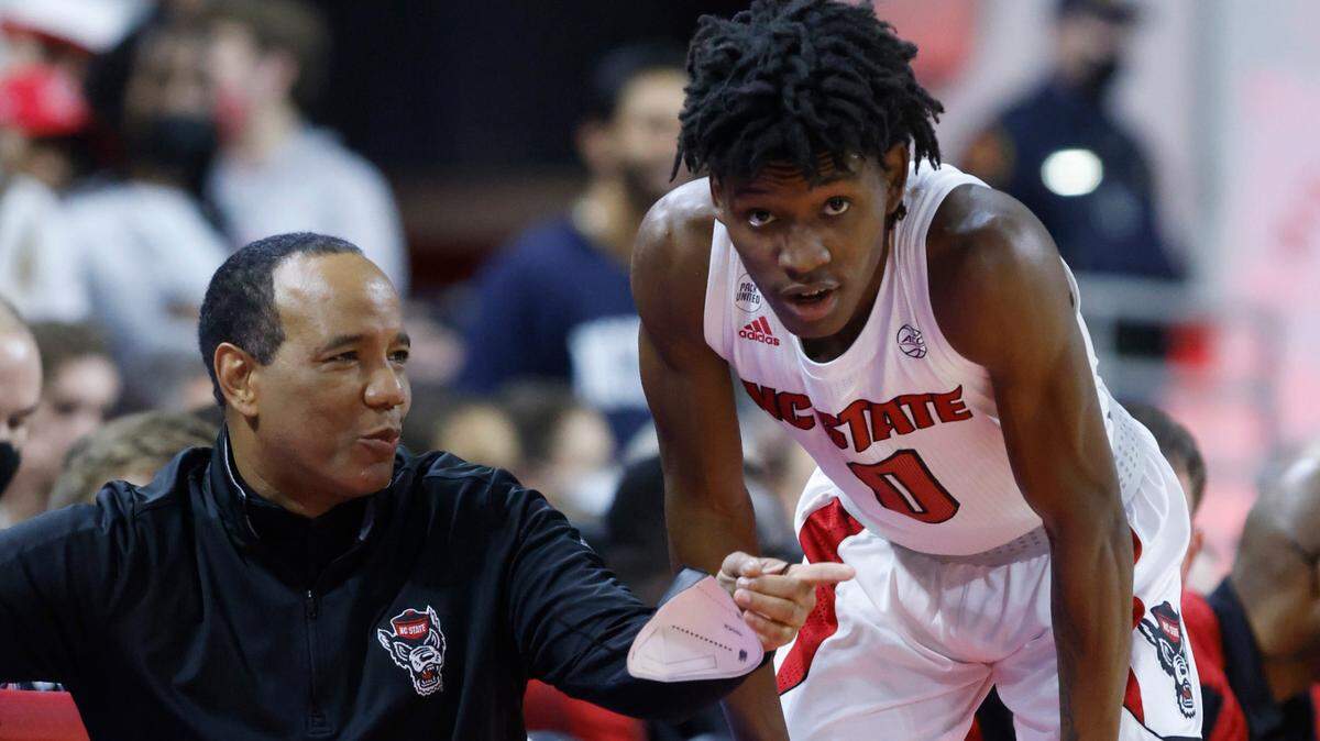 N.C. State head coach Kevin Keatts talks with Terquavion Smith (0) during the first half of N.C. State’s game against Wake Forest at PNC Arena in Raleigh, N.C., Wednesday, Feb. 9, 2022.