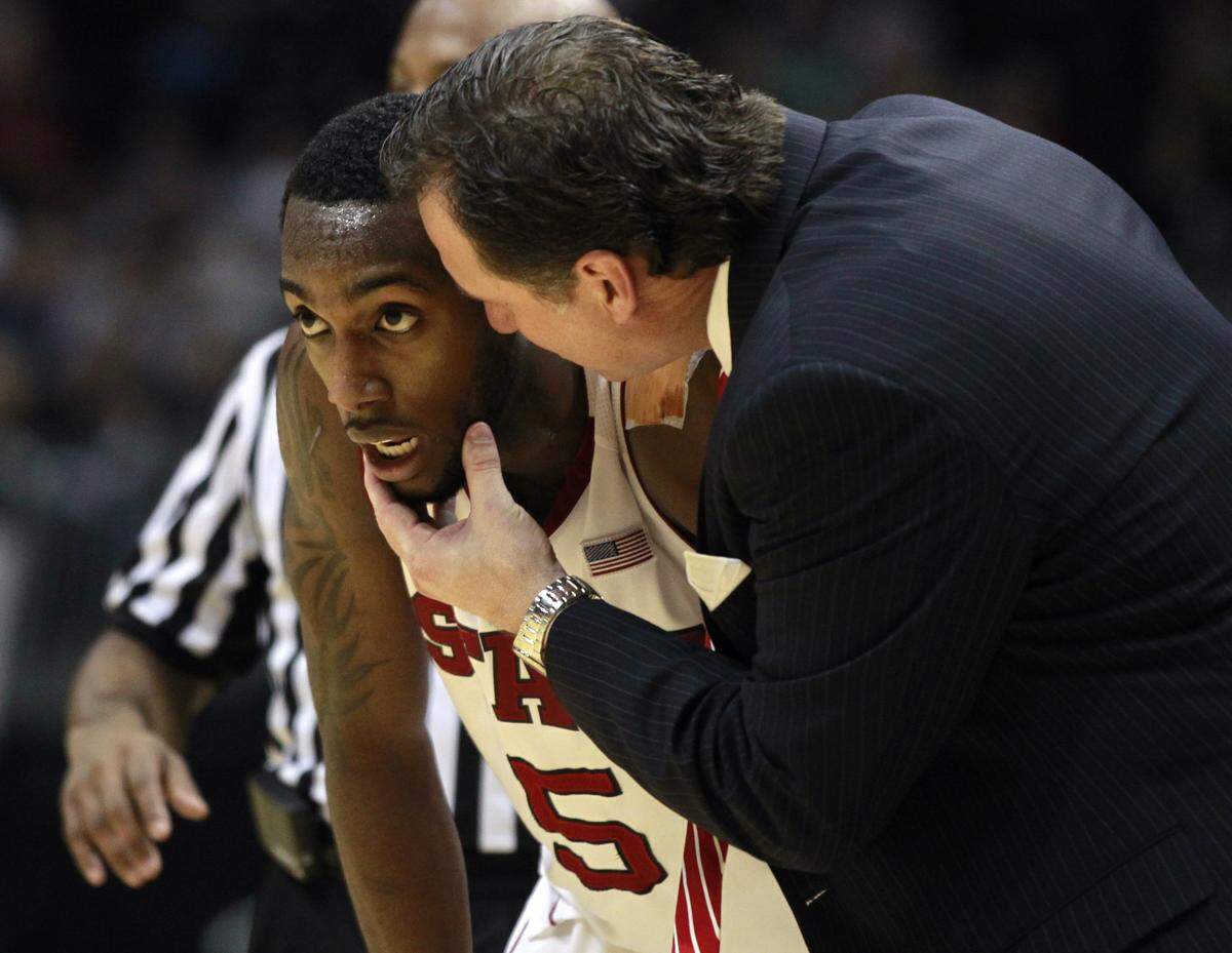 N.C. State's Mark Gottfried talks with N.C. State's C.J. Leslie (5) during the second half of N.C. State's 78-57 victory over Boston College in the first round of the ACC Men's Basketball Tournament Thursday, March 8, 2012, at Philips Arena in Atlanta, GA.