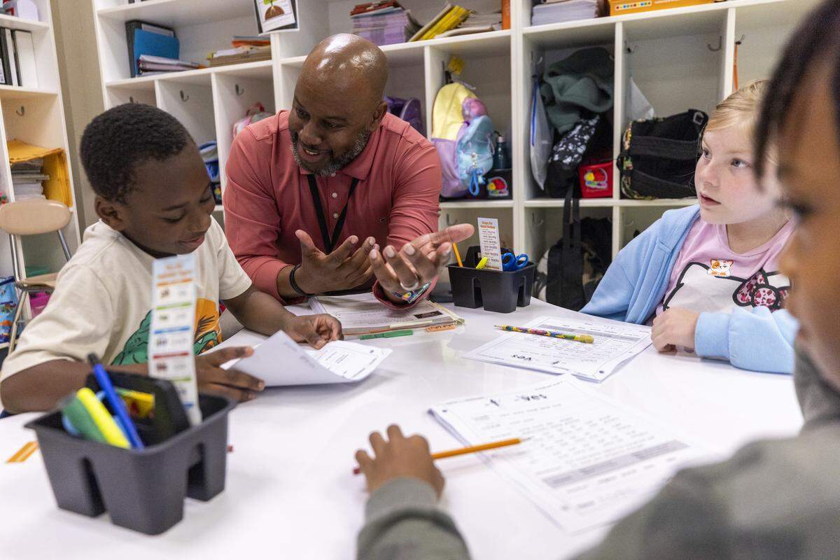 Teacher’s assistant Ryan Dozier leads a reading lesson with second graders Thursday, April 30, 2026, at Aversboro Elementary School in Garner.
