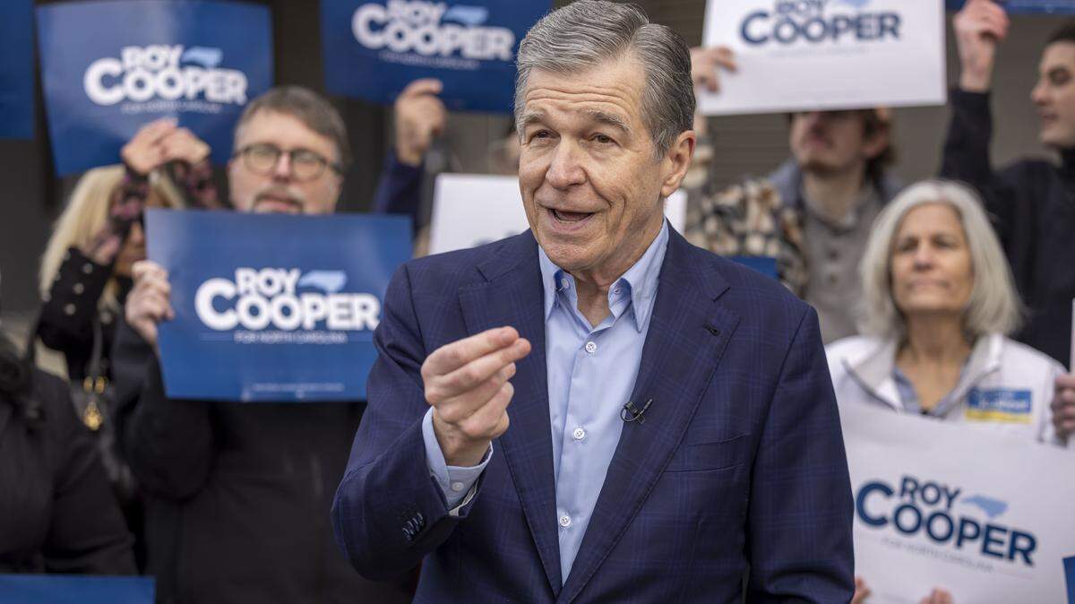 Former NC Governor and US Senate candidate Roy Cooper, talks with supporters and the media after casting his ballot, on the first day of early voting in the North Carolina primary, on Thursday, February 12, 2026 in Raleigh, N.C.