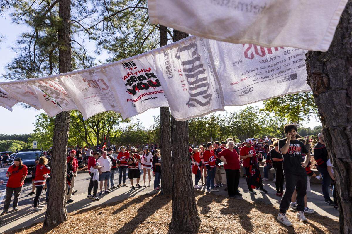 Carolina Hurricanes fans get ready for Game 1 of the Stanley Cup Final outside the Lenovo Center in Raleigh on Tuesday, June 2, 2026. For the first time since 2006, the Hurricanes are playing in the Stanley Cup Final, facing the Vegas Golden Knights, who won the Stanley Cup in 2023.