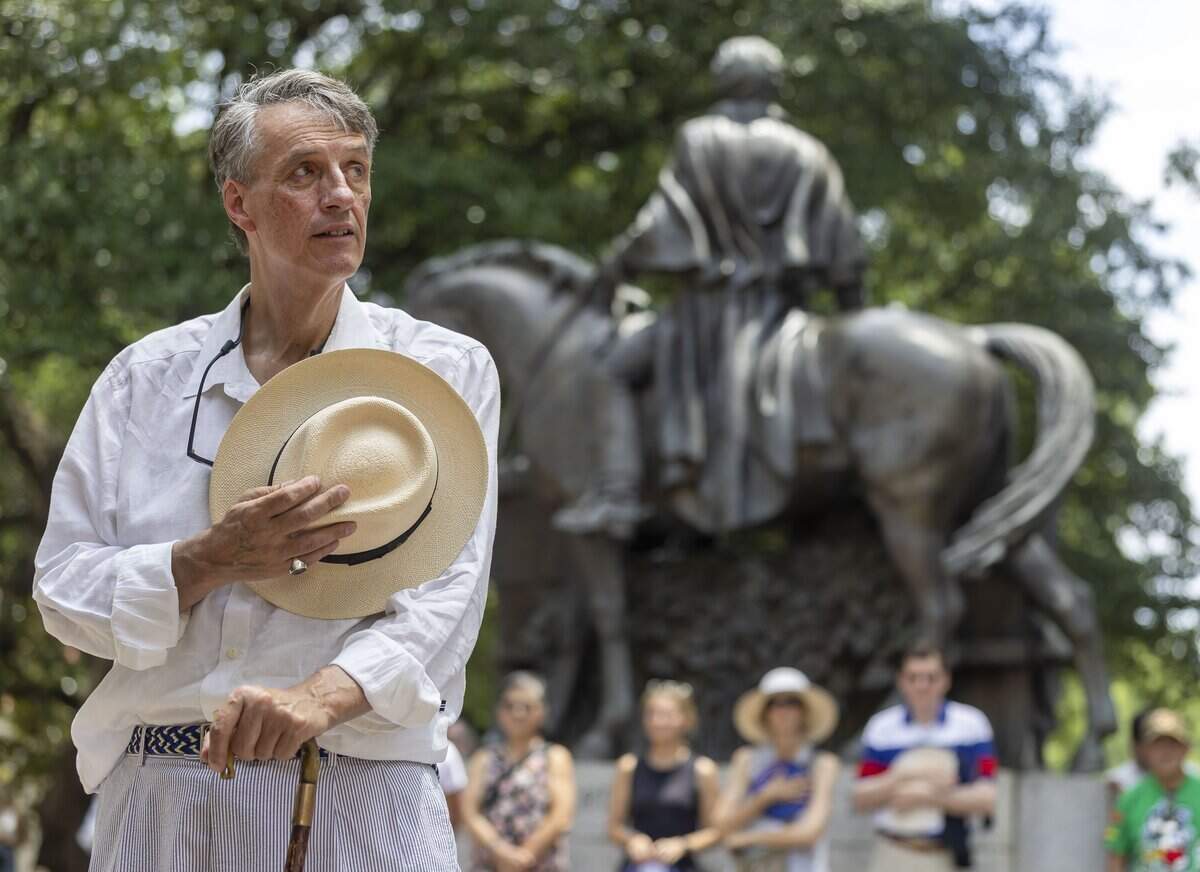 Kevin Cherry stands for the Pledge of Allegiance during the Freedom Fest 250, celebrating the country’s Semiquincentennial, on Saturday, July 4, 2026 in Raleigh, N.C.