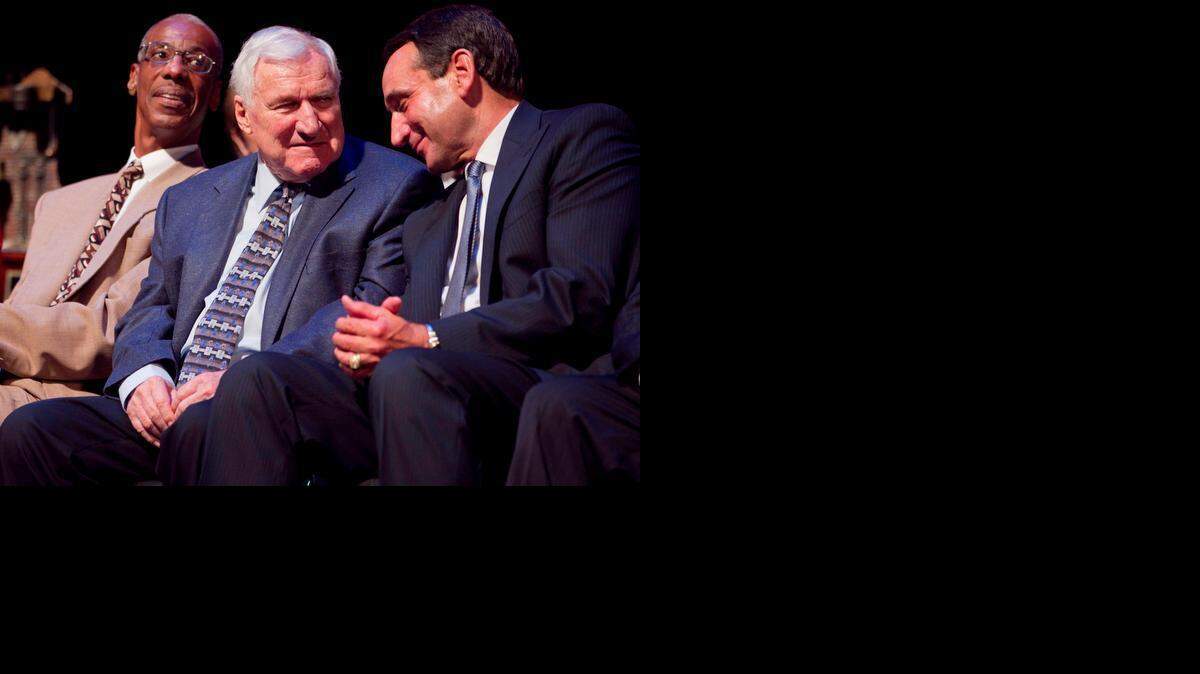 Duke coach Mike Krzyzewski acknowledges former UNC coach Dean Smith as Smith is honored with the Dr. James A. Naismith Good Sportsmanship Award on June 29, 2011, at Memorial Auditorium in Raleigh, N.C.
