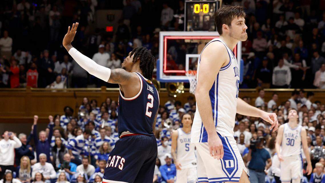 Arizona’s Caleb Love (2) waves to the Cameron Crazies as Duke’s Ryan Young (15) walks off the court after Arizona’s 78-73 victory over Duke at Cameron Indoor Stadium in Durham, N.C., Friday, Nov. 10, 2023.