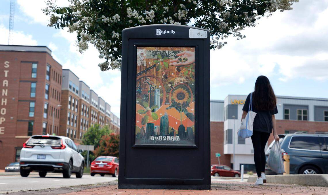 The Charlotte skyline is seen in the artwork on the side of solar waste station on Hillsborough Street by Bagwell Avenue in Raleigh, N.C., Tuesday, July 19, 2022.