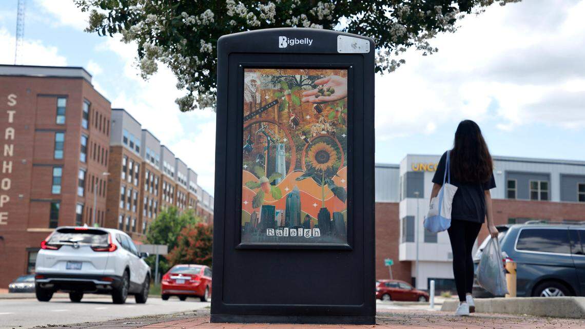 The Charlotte skyline is seen in the artwork on the side of solar waste station on Hillsborough Street by Bagwell Avenue in Raleigh, N.C., Tuesday, July 19, 2022.