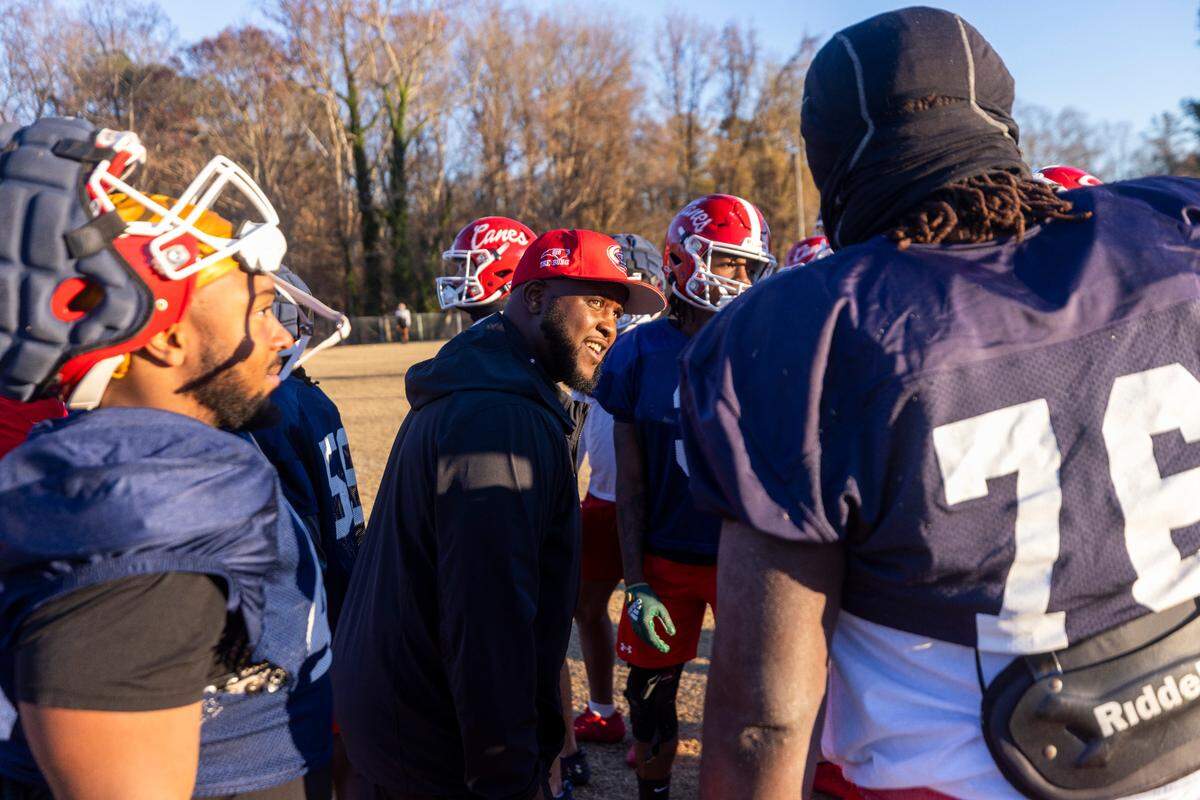 Louisburg College Head Football Coach Quinderra Spellman leads his team during their final practice on Tuesday, Dec. 3, 2004, in Louisburg. The team is heading to the NJCAA National Championship for the first time in the program’s 20-year history.