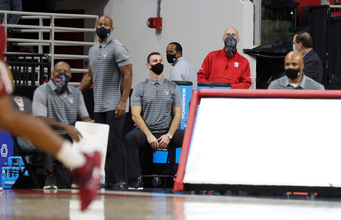 N.C. State head coach Kevin Keatts walks off the court with a second left in the first half of N.C. State’s game against Boston College at PNC Arena in Raleigh, N.C., Wednesday, December 30, 2020.