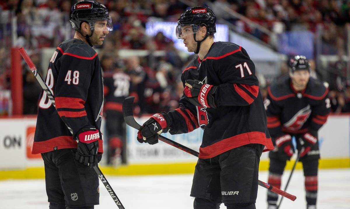 The Carolina Hurricanes Jordan Martinook (48) confers with Jesper Fast (71) during the first period against Ottawa on Wednesday, October 11, 2023 at PNC Arena, in Raleigh N.C.