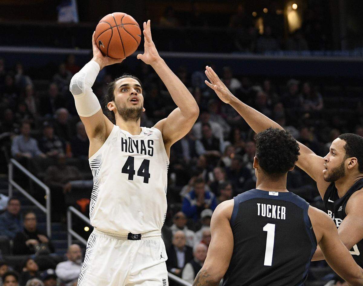 Georgetown center Omer Yurtseven (44) goes to the basket as Butler’s Jordan Tucker (1), and Bryce Nze, right, defend Tuesday, Jan. 28, 2020, in Washington.