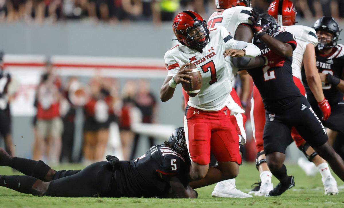 N.C. State defensive tackle C.J. Clark (5) sacks Texas Tech quarterback Donovan Smith (7) during the second half of N.C. State’s 27-14 victory over Texas Tech at Carter-Finley Stadium in Raleigh, N.C., Saturday, Sept. 17, 2022.