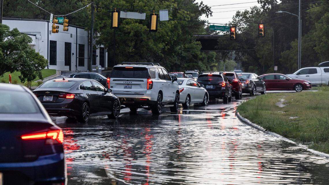 Drivers navigate the intersection of Atlantic Avenue and Hodges Street in Raleigh following a during a severe thunderstorm that swept through the Triangle on Tuesday afternoon, Aug 15, 2023.