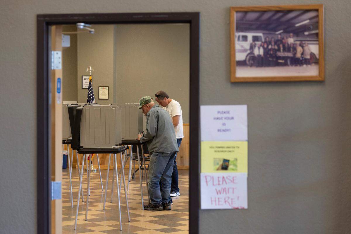 Voters cast their ballots at the fire department polling site in Mitchell County on Thursday, October 17, 2024 in Spruce Pine, N.C.