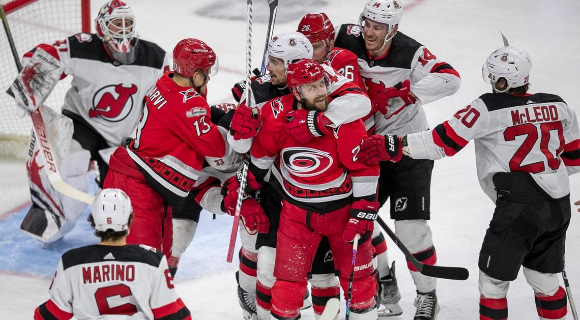 The New Jersey Devils Miles Wood (44) tangles with the Carolina Hurricanes Derek Stepan (21) in front of New Jersey goalie Vivek Vanecek (41) in the third period during Game 1 of their second round Stanley Cup playoff series on Wednesday, May 3, 2023 at PNC Arena in Raleigh, N.C.