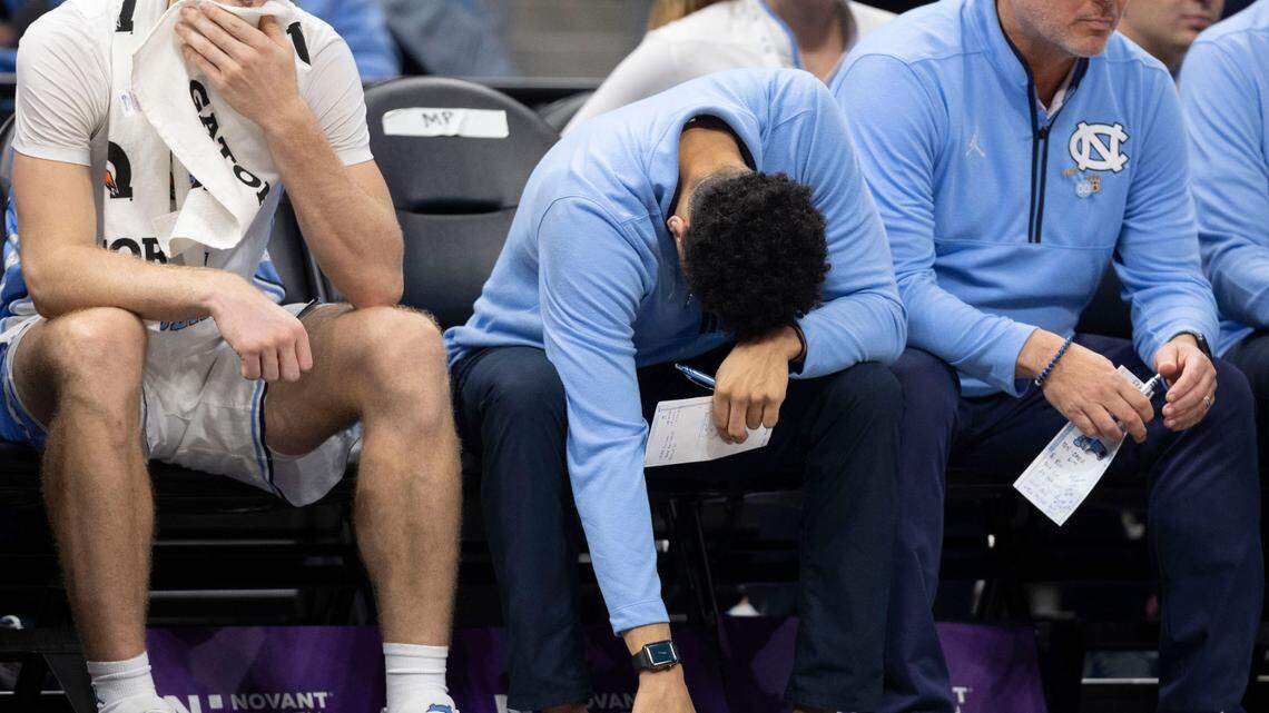 North Carolina assistant coach Marcus Paige hangs his head after guard Elliot Cadeau (3) missed a free throw with six seconds to play, securing Florida’s 90-84 victory, during the Jumpman Invitational on Tuesday, December 17, 2024 at the Spectrum Center in Charlotte, N.C.