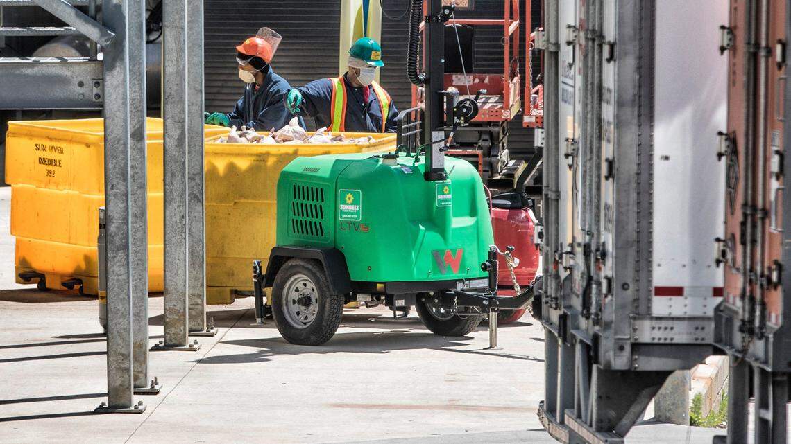 Workers at the Mountaire Farms chicken processing plant in Siler City, N.C. are seen working on Wednesday, April 22, 2020. The plant notified employees on April 13 that three of their co-workers had tested positive for COVID-19.