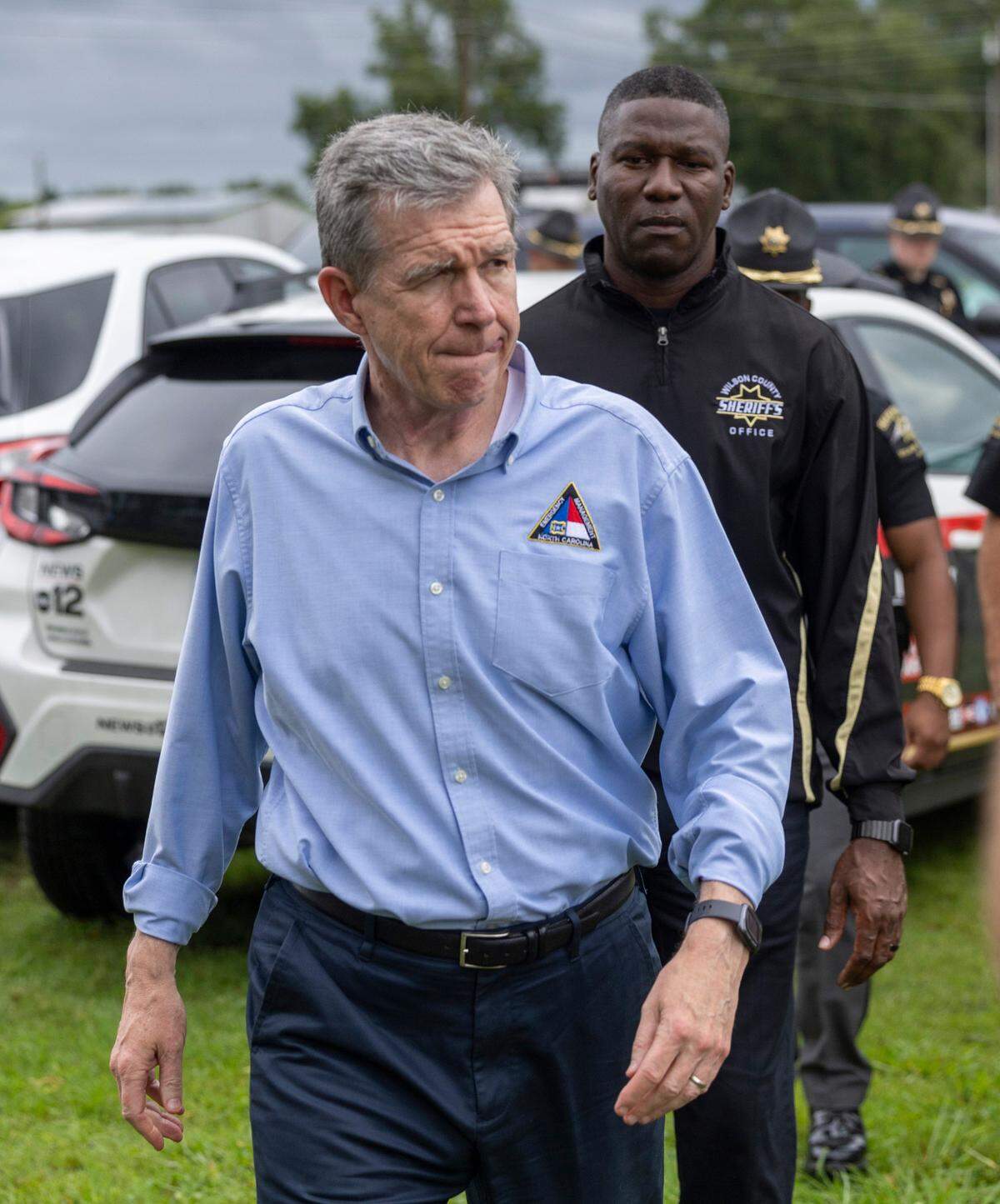 Gov. Roy Cooper prepares to talk with reporters after touring Springfield Middle School in the Lucama area of Wilson County where a tornado damaged the school and at least 10 homes as bands from Tropical Storm Debbie moved through the area on Thursday, Aug. 8, 2024. One person was killed by the tornado.