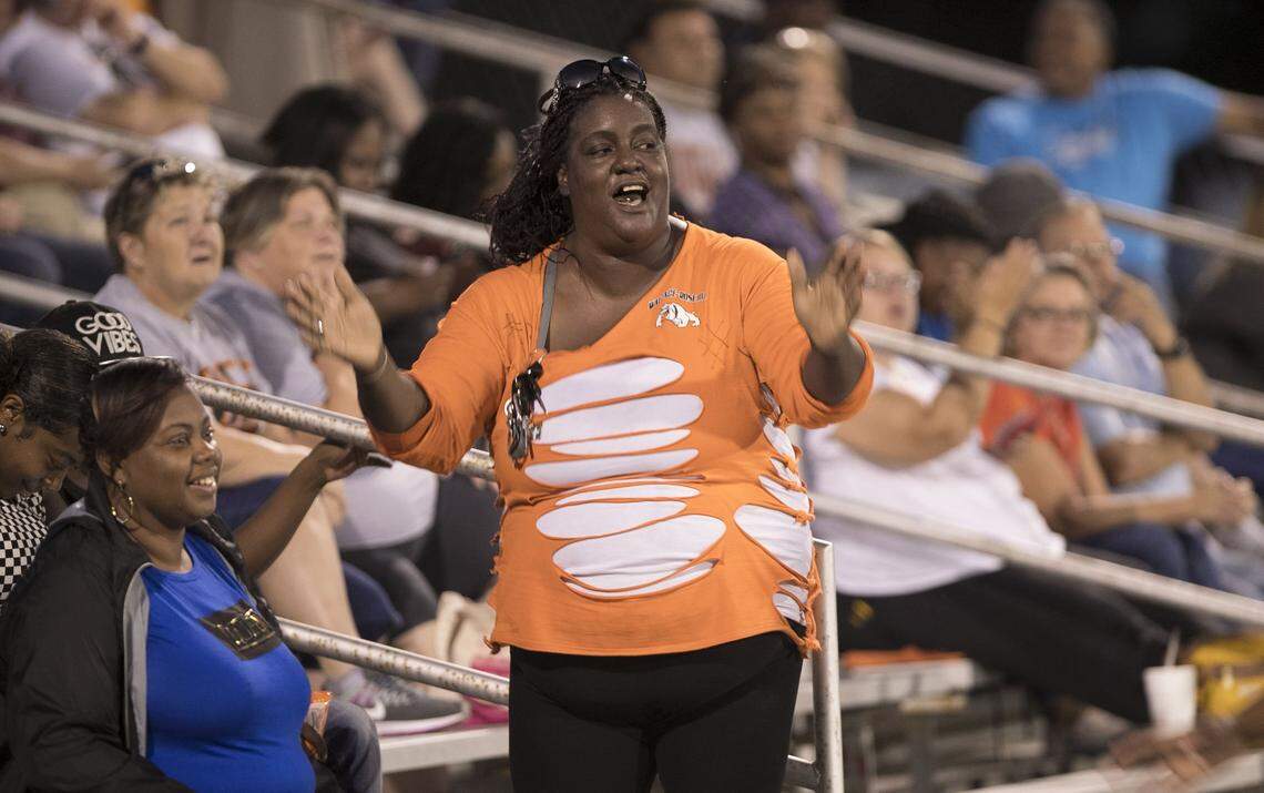 Wannee Basden show her excitement after her son Cameron Dalrymple scored a touchdown for Wallace-Rose Hill during their game against Spring Creek High School on Friday, October 5, 2018 in Seven Springs, N.C.