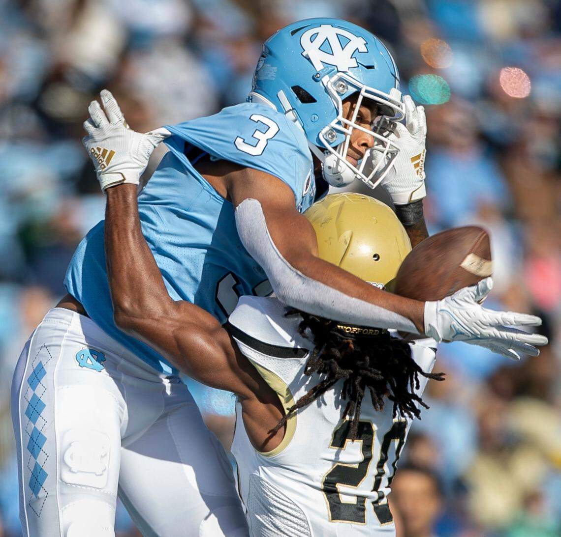 Wofford’s Donovan Anderson (20) is called for pass interference as he defends North Carolina’s Antoine Green (3) in the third quarter on Saturday, November 20, 2021 at Kenan Stadium in Chapel Hill, N.C.