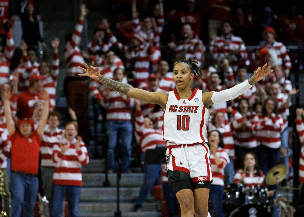 N.C. State’s Aziaha James reacts after making a three-point basket during overtime of the Wolfpack’s 88-80 win over Florida State on Thursday, Jan. 4, 2023, at Reynolds Coliseum in Raleigh, N.C.
