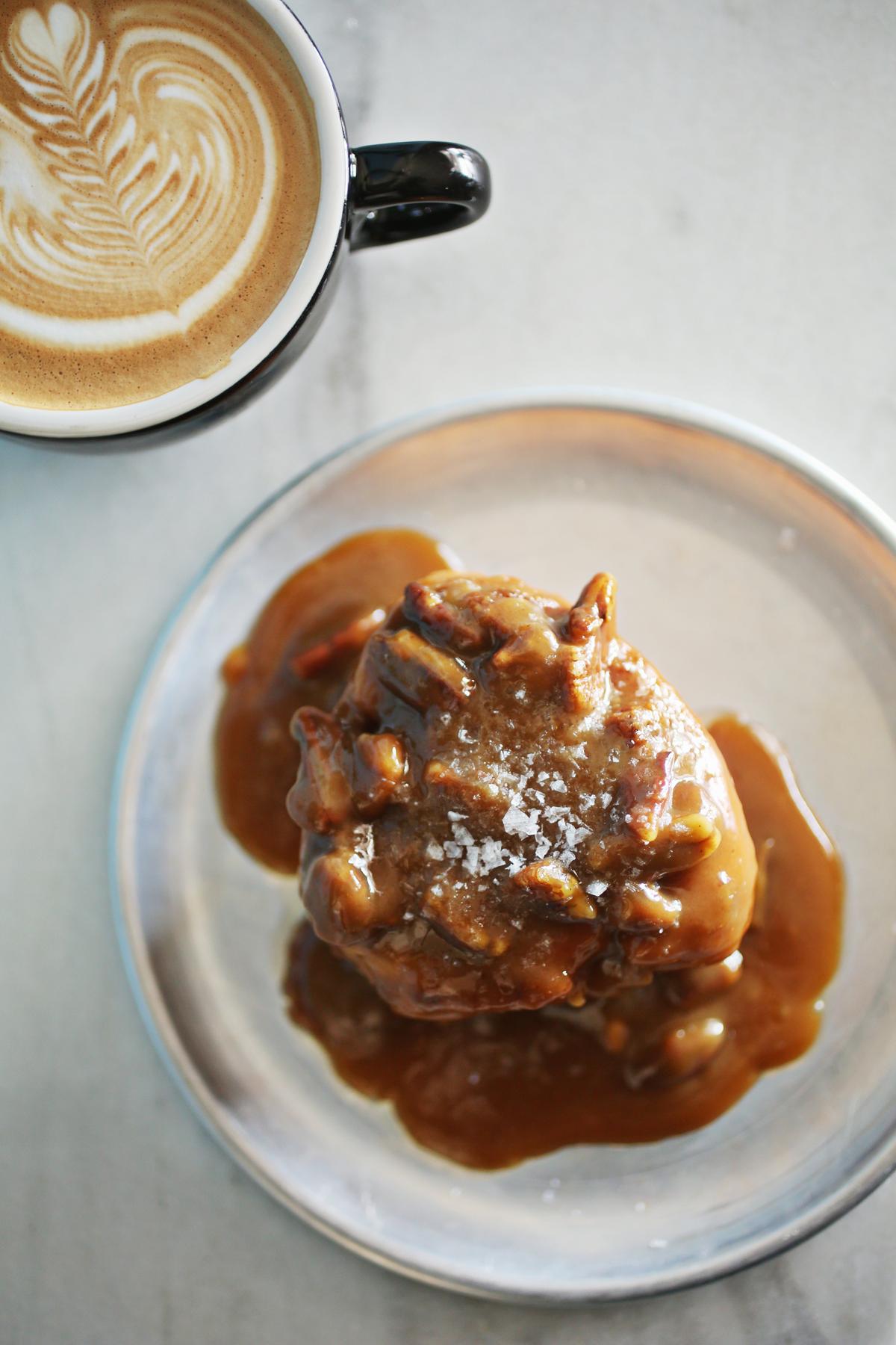 Pair a Vanilla Latte with a Butterscotch Sticky Bun for breakfast at Hummingbird in Raleigh.
