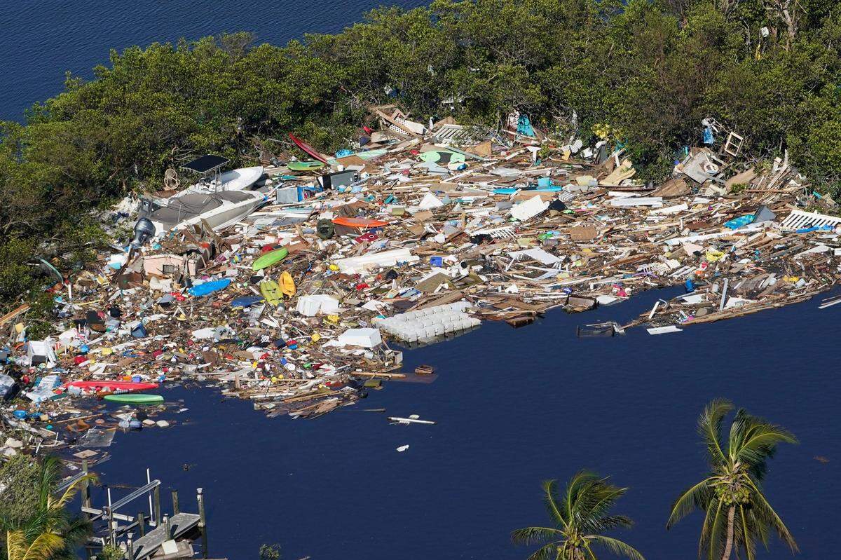 Debris is piled up at the end of a cove following heavy winds and storm surge caused by Hurricane Ian Thursday, Sept. 29, 2022, in Barefoot Beach, Fla.