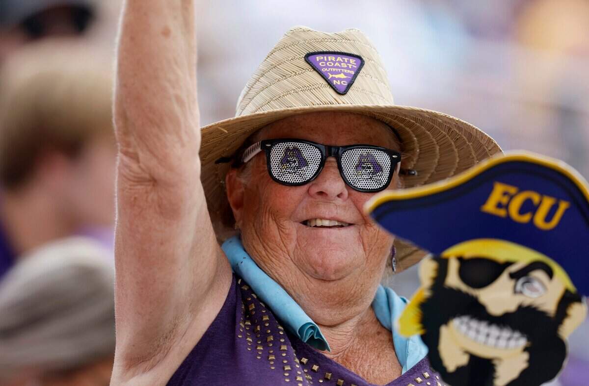 Kathy Varvour of Raleigh cheers on the Pirates during ECUs 13-7 victory over Texas in the Greenville Super Regional at Clark-LeClair Stadium Friday, June 10, 2022.