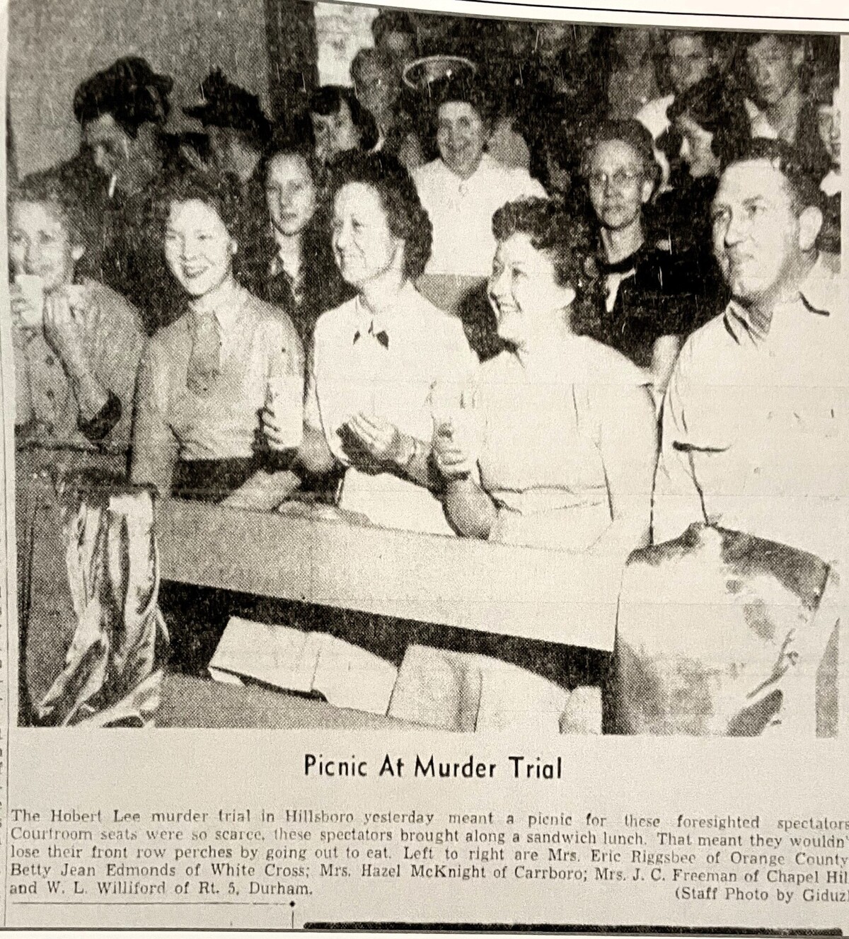 A Herald-Sun newspaper clipping shows people packed into the Historic Orange County Courthouse in Hillsborough for the trial of Hobart Lee, who was accused of the brutal 1951 murder of Rachel Crook, a 71-year-old UNC doctoral student and businesswoman.