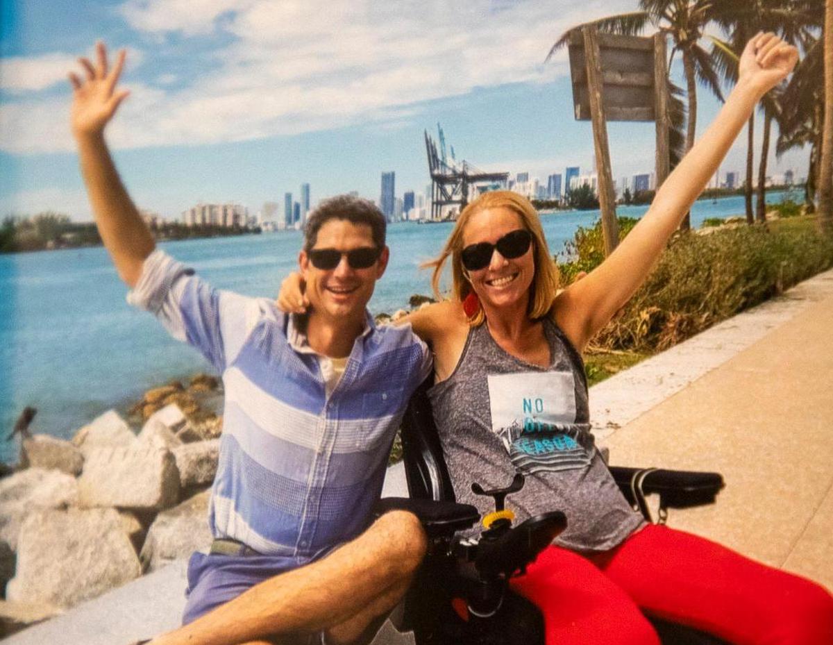 A photo from vacation in Miami hangs on the wall in the home of Ali Ingersoll who is paralyzed from the neck down and has been denied insurance coverage by Blue Cross Blue Shield of North Carolina for a specific piece of wheelchair equipment she believes to be medically necessary, and only until sharing her story publicly and now advocating for other people with disabilities facing the same battles with insurance, was her appeal accepted and the equipment ordered, on Tuesday, July 7, 2020, in Raleigh, N.C.