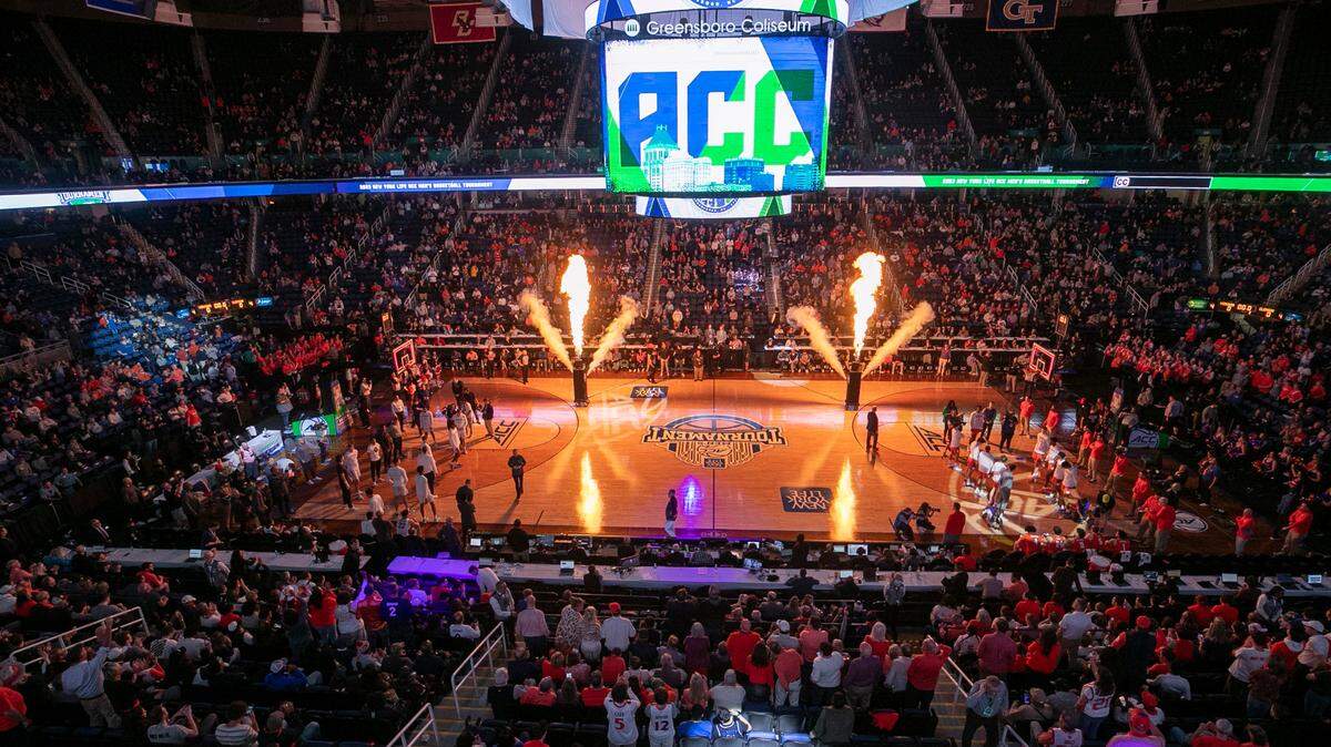 The Greensboro Coliseum is illuminated by flash pots prior to the player introductions for the Clemson vs Virginia game in the semi-finals of the ACC Tournament on Friday, March 10, 2023 at the Greensboro Coliseum in Greensboro, N.C.