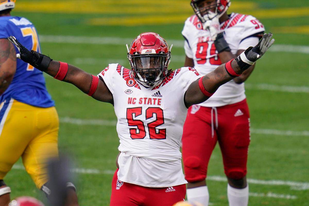 North Carolina State defensive tackle C.J. Clark (52) celebrates as he plays against Pittsburgh during an NCAA college football game, Saturday, Oct. 3, 2020, in Pittsburgh.