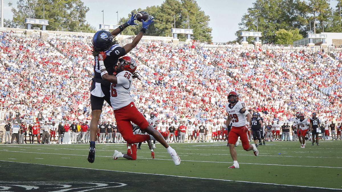 Duke’s Landen King pulls in a pass over N.C. State’s Asaad Brown Jr. for a touchdown during the first half of the Blue Devils’ game on Saturday, Sept. 20, 2025, at Wallace Wade Stadium in Durham, N.C.