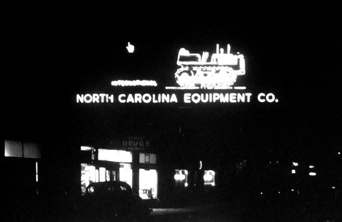A historic photo of the bulldozer sign at N.C. Equipment Co., which once marked Raleigh’s western edge.