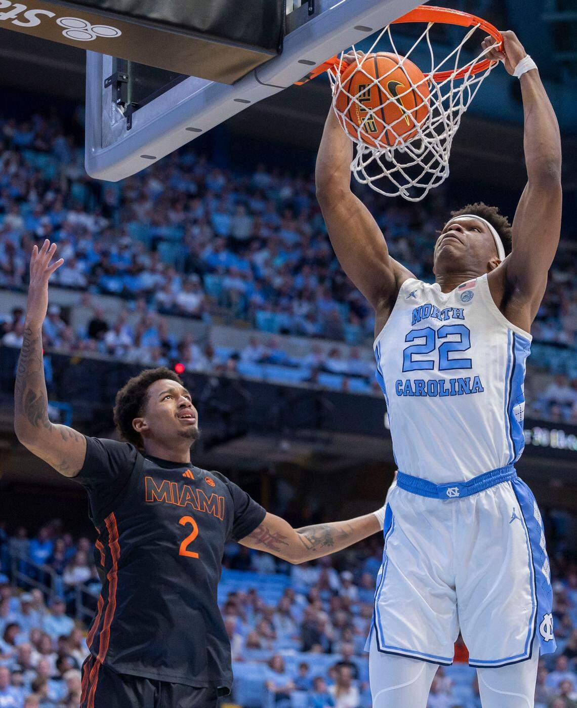 North Carolina’s Ven-Allen Lubin (22) dunks over Miami’s forward Brandon Johnson (2) in the first half on Saturday, March 1, 2025 at the Smith Center in Chapel Hill, N.C.