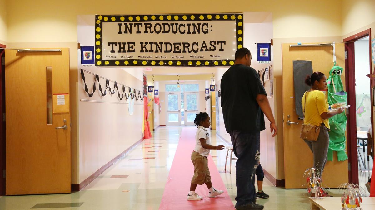 Parents and students are greeted by banners and a “red carpet” at Barwell Road Elementary School on July 25, 2018. The draft 2023-24 student assignment plan calls for moving some students out of Barwell to reduce crowding.